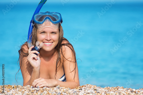 Woman on beach vacation holidays, lying in sand with snorkeling mask © steevy84