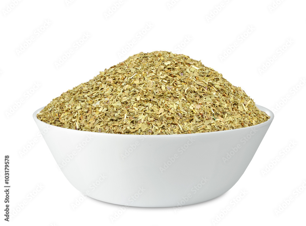 spice basil in a bowl isolated on white background spice basil in a bowl isolated on white background