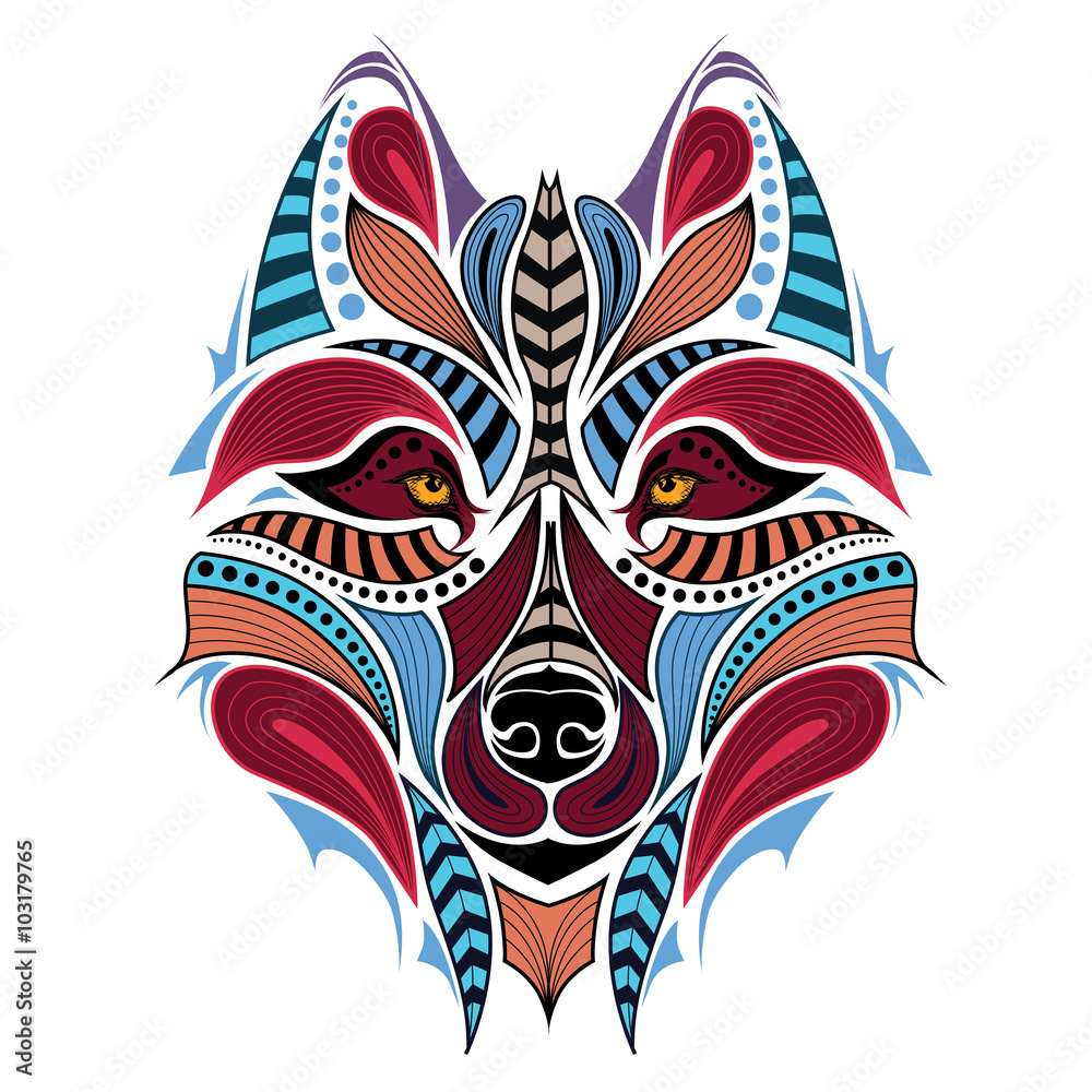 Naklejka premium Patterned colored head of the wolf. African / indian / totem / tattoo design. It may be used for design of a t-shirt, bag, postcard and poster.