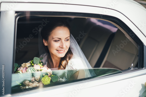 close-up portrait of a bride in car window