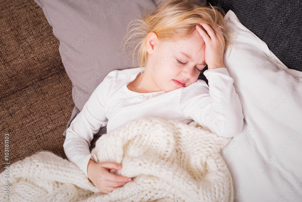 Little sick child lying on couch Little sick child lying on couch
