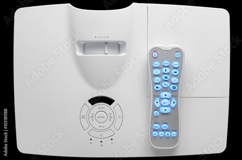 Stylish white home cinema projector with remote, top down view