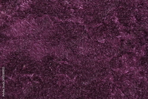 Purple fluffy carpet texture of textile for blank and pure backgrounds photo