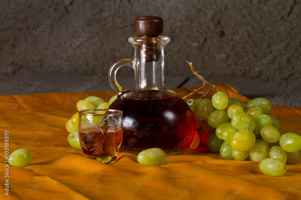 Decanter of brandy and grape Decanter of brandy and grape