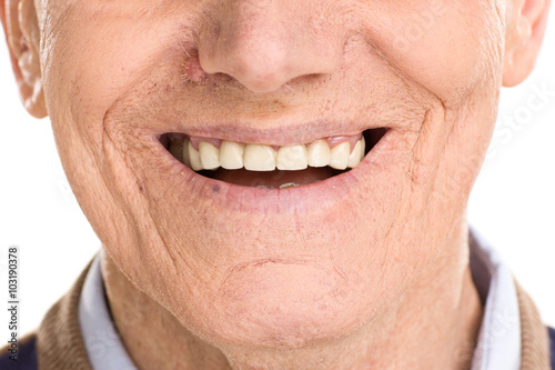 Close-up on cheerful senior man smiling