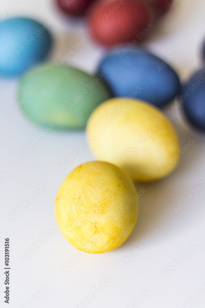 Easter, colorful painted eggs in in a cardboard box. Each color is from the different natural colorant. Easter, colorful painted eggs in in a cardboard box. Each color is from the different natural colorant.
