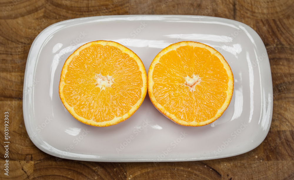 orange fruit slice on white plate orange fruit slice on white plate