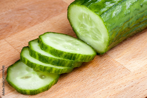 A slices of cucumber on the cutting board