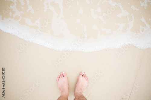 Feet stand with wave splash