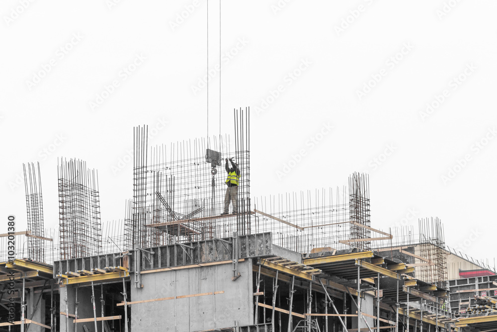 Man working on scaffold. Man worker working on scaffold on cold