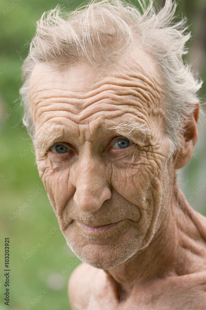 An elderly white-haired, unshaven man An elderly white-haired, unshaven man