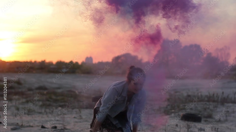 Girl spinning with smoke bombs in her hands. Girl spinning with smoke bombs in her hands.