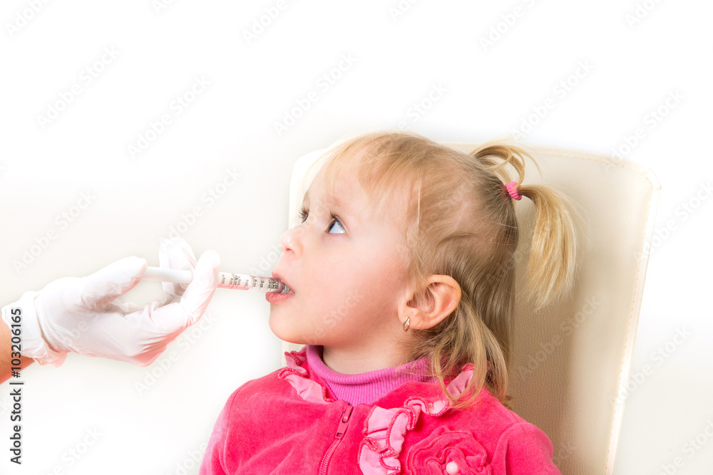 The little girl on reception at the doctor takes antipyretic, an The little girl on reception at the doctor takes antipyretic, an