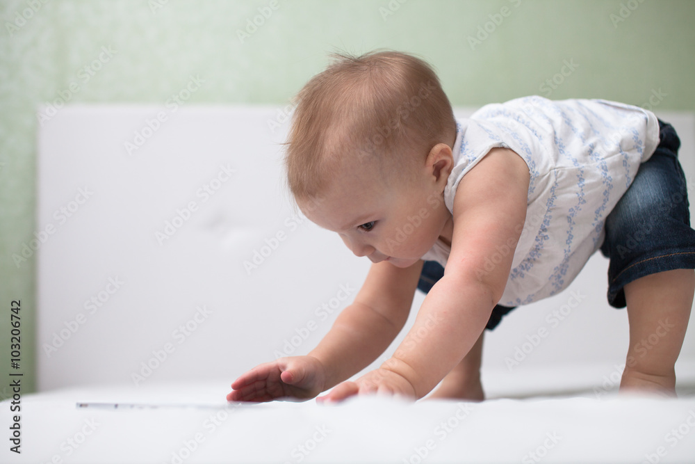 Infant child baby toddler sitting and typing digital tablet comp Infant child baby toddler sitting and typing digital tablet comp