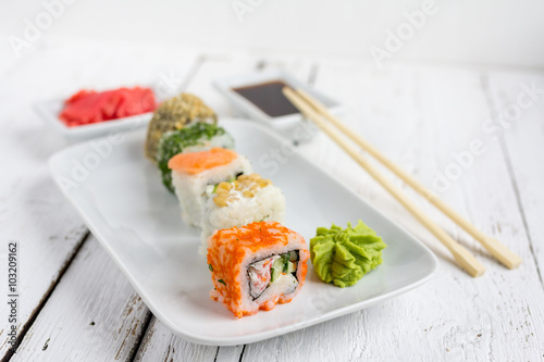 Sushi set on white wooden background