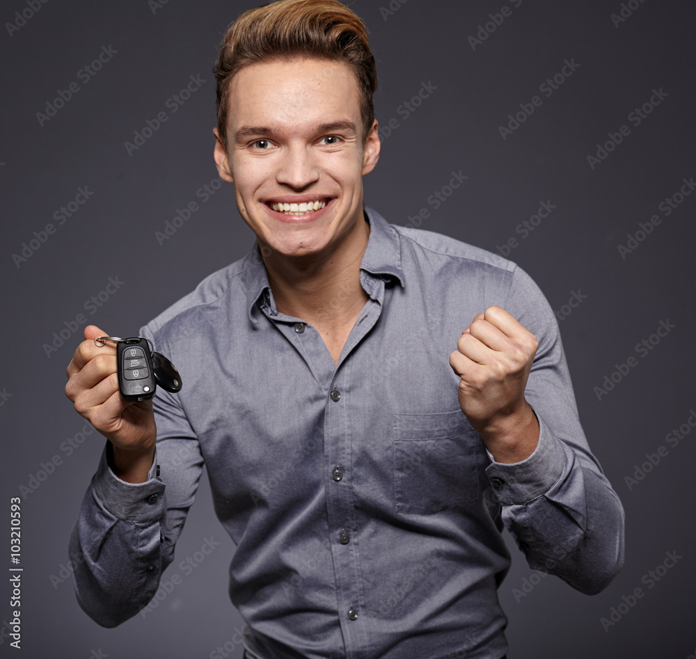 Man with Car Keys and Thumbs Up