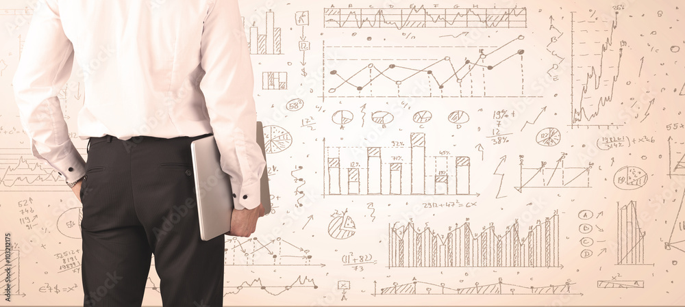 Businessman with diagrams and graphs Businessman with diagrams and graphs