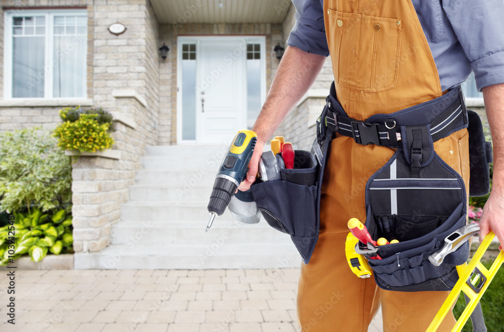 Builder handyman near new house. Builder handyman near new house.