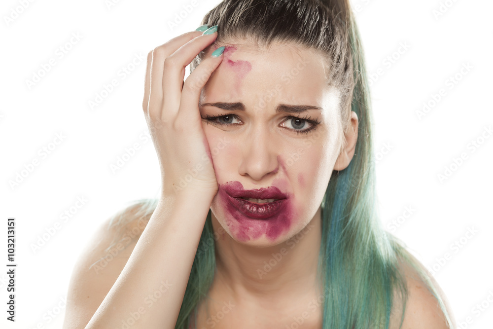 desperate young woman with smeared makeup desperate young woman with smeared makeup