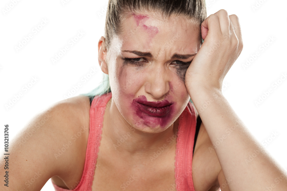 desperate and crying young woman with smeared makeup desperate and crying young woman with smeared makeup
