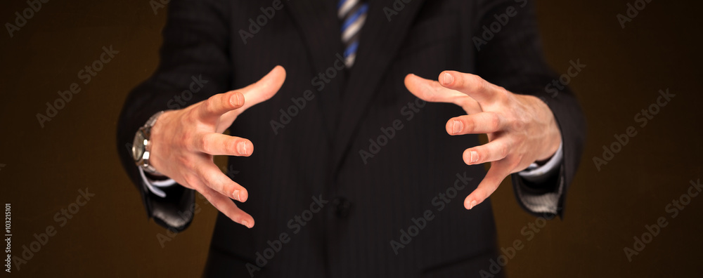 Obraz premium Businessman holding something