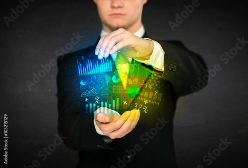 Businessman holding diagram cloud