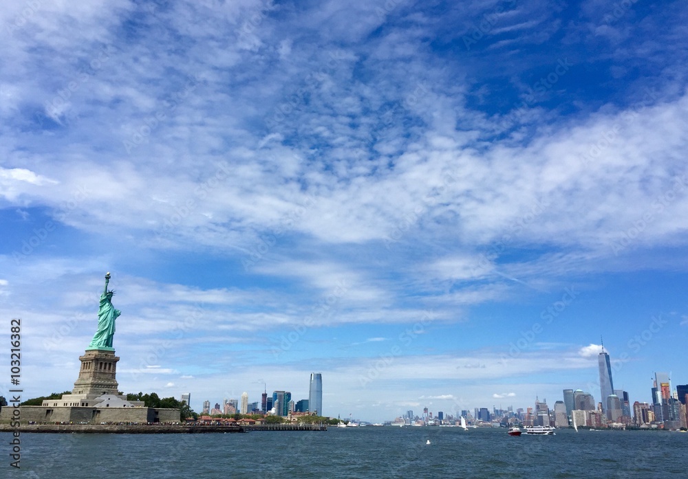 Statue of Liberty and the city with blue sky