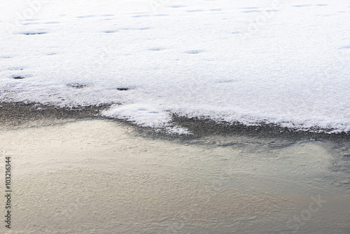 Icy lake with a snow cover ...