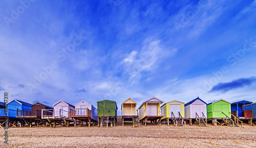 Beach huts with a blue sky background