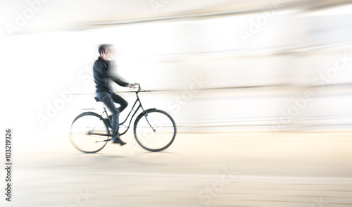 young man on bike talking in mobile phone