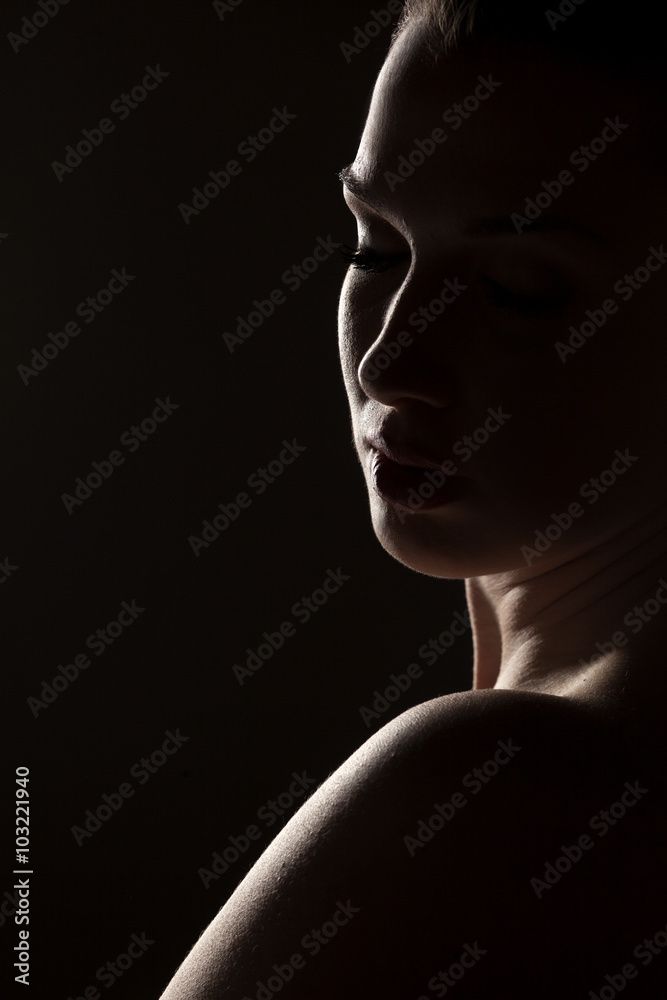 silhouette of a woman on a dark background
