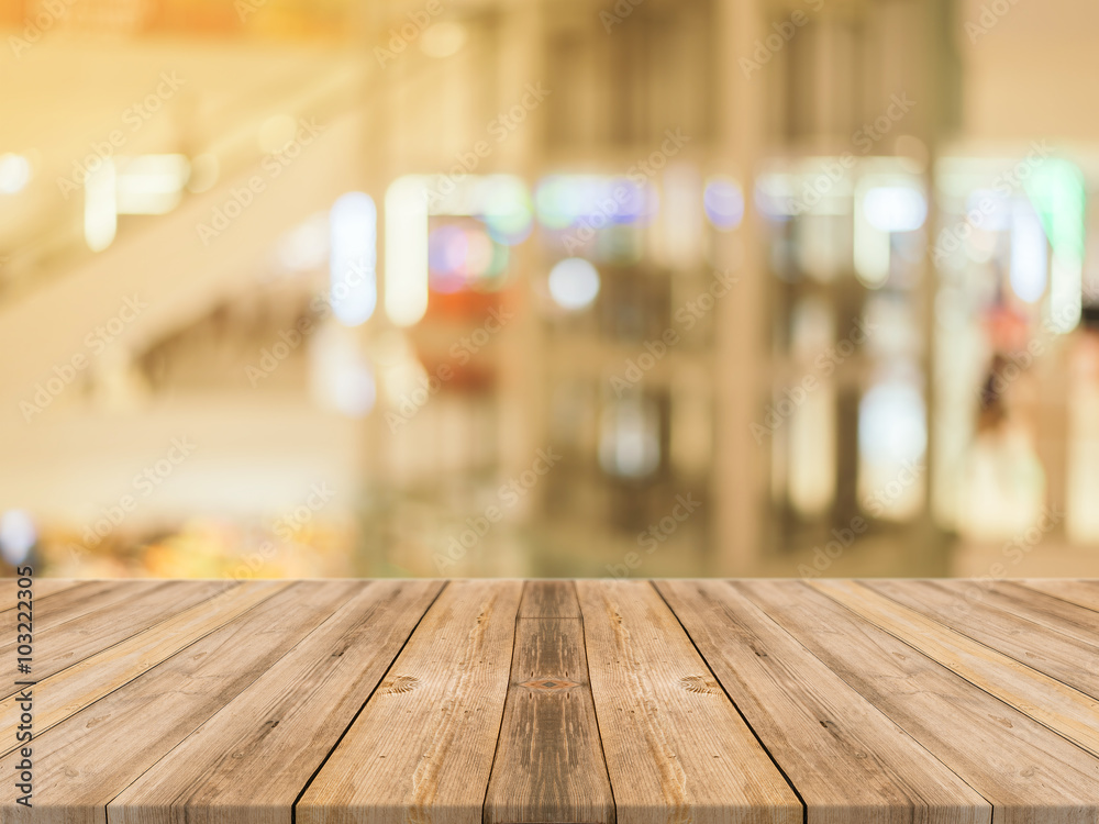 Wooden board empty table blurred background. Perspective brown wood over blur in department store - can be used for display or montage your products.Mock up for display of product. Wooden board empty table blurred background. Perspective brown wood over blur in department store - can be used for display or montage your products.Mock up for display of product.