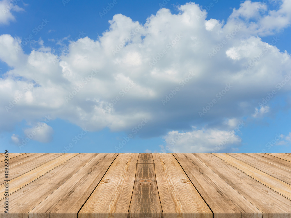 Vintage wooden board empty table in front of sky background. Perspective wood floor over sky - can be used for display or montage your products. beach & summer concepts.