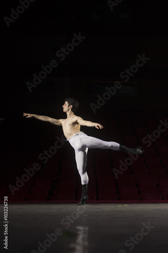 Male ballet dancer on one leg.
