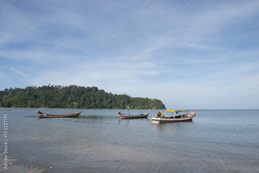 Adaman sea and wooden boat in Thailand