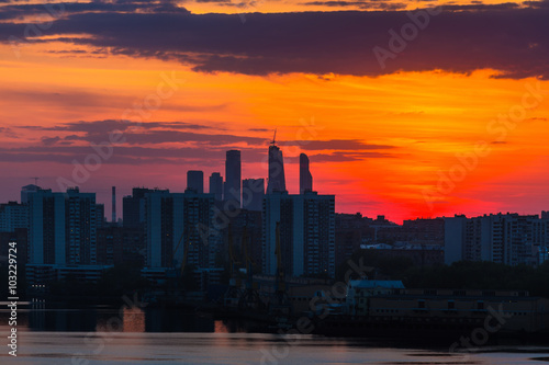 Sunrise at the city. Silhouette of buildings.