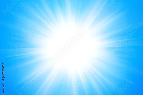 Shining sun at clear blue sky background. 