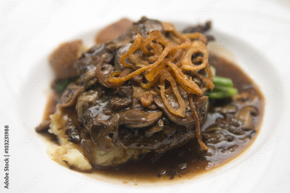 Rump Steak with mash potato, caramelized onions topped with mushroom sauce Rump Steak with mash potato, caramelized onions topped with mushroom sauce