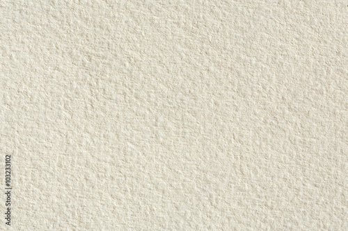 Paper texture background in light cream tone.