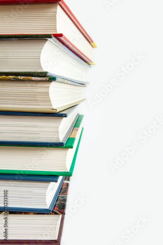 Stack of books on white background.