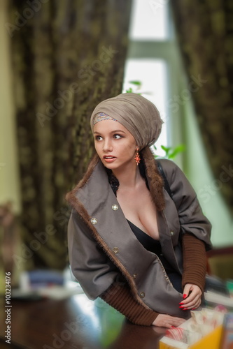 Girl in coat at the reception.