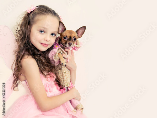 blond kid girl with small pet dog