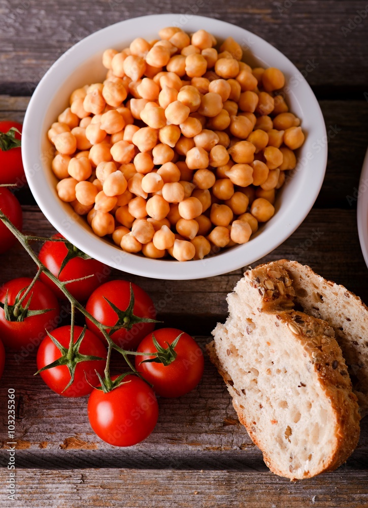 Bowl with chickpeas with tomatoes and bread Bowl with chickpeas with tomatoes and bread