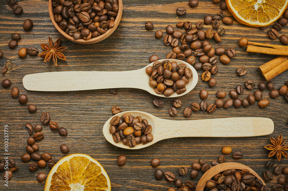 Coffee beans background with spoons. Roasted coffee in the spoon. Top view. Selective focus Coffee beans background with spoons. Roasted coffee in the spoon. Top view. Selective focus