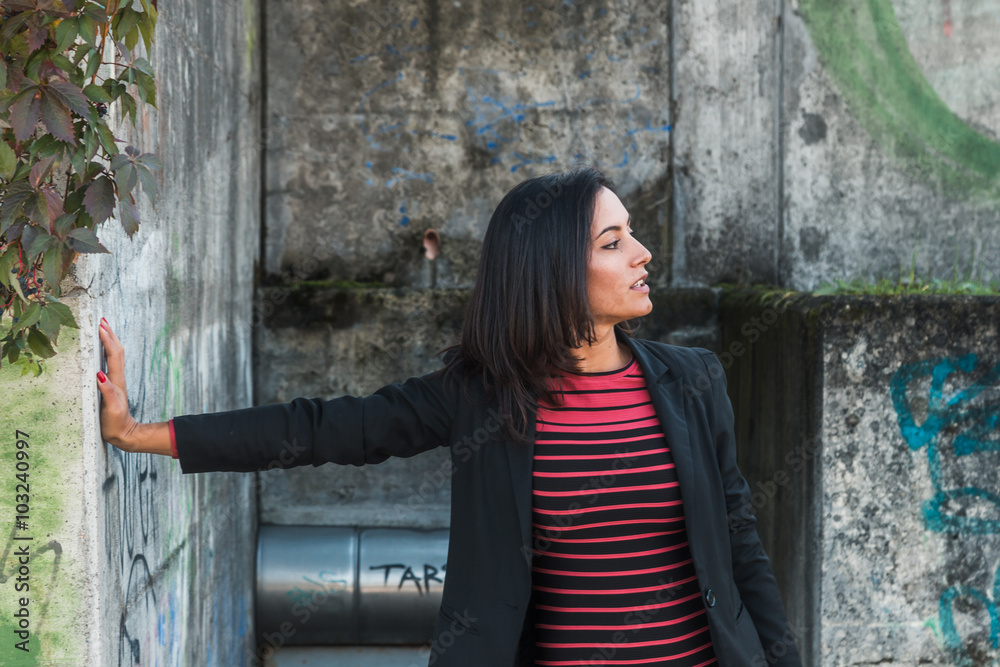 Beautiful girl posing in an urban context Beautiful girl posing in an urban context