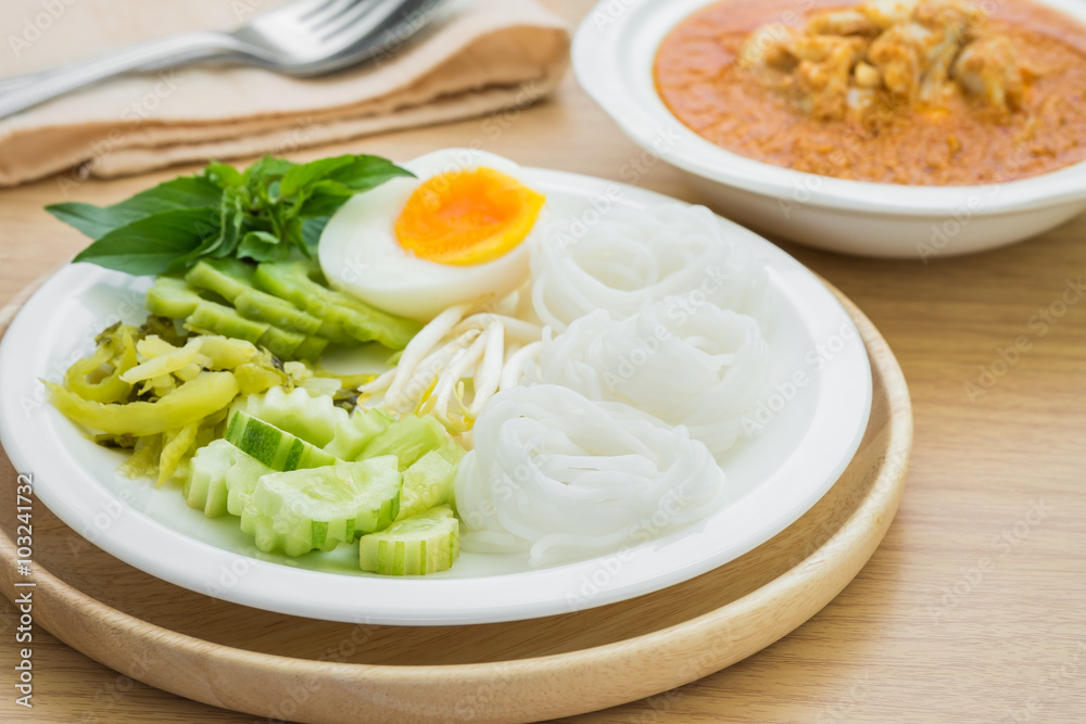 Rice noodles with boiled egg on plate and curry crab, Thai food Rice noodles with boiled egg on plate and curry crab, Thai food