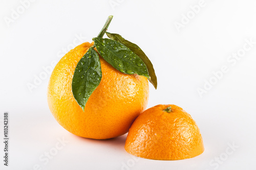 Orange fruits with leaves isolated over white background