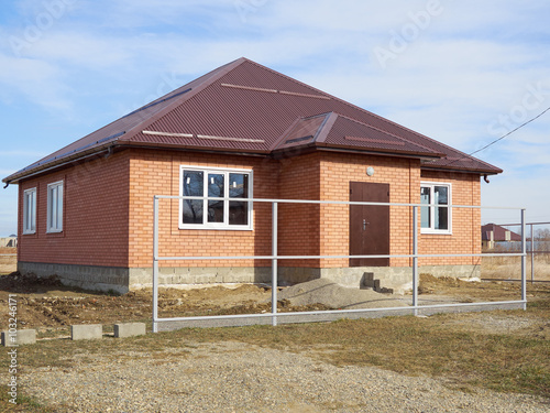 Building & Construction Site in progress to new house. © volkovslava