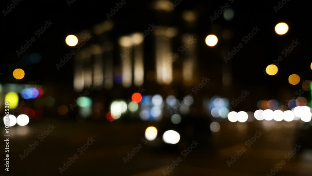 Slow motion shot of defocused traffic in the city at night Slow motion shot of defocused traffic in the city at night