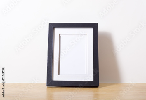 Black picture frame on desk